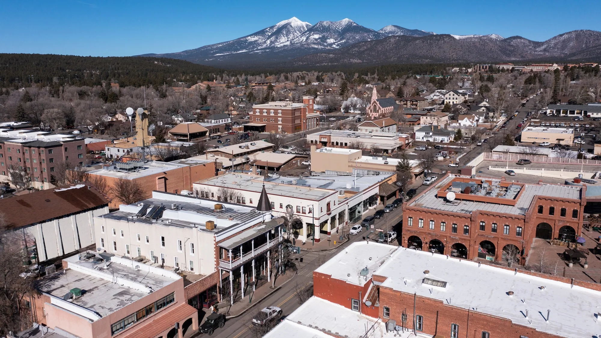 Downtown Flagstaff rooftops below the San Francisco Peaks